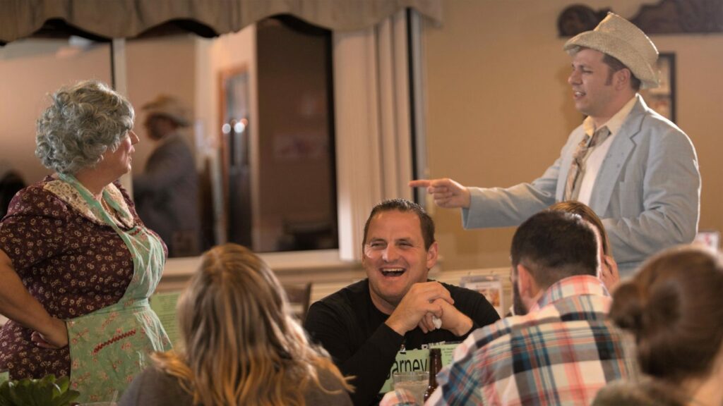 Guest at murder mystery party laugh out loud