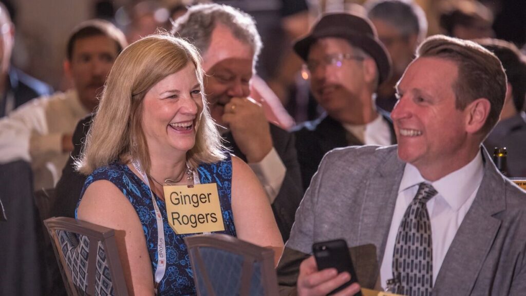 Laughing and smiling murder mystery corporate event audience