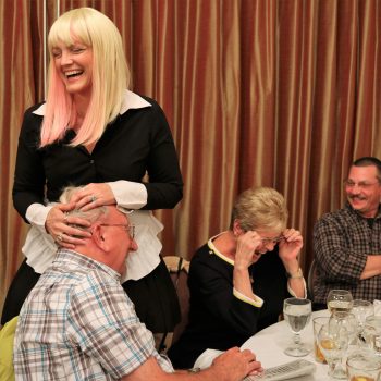 Murder mystery dinner guest laughs out loud