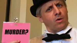 Murder? on a murder mystery guest badge held by entertainer