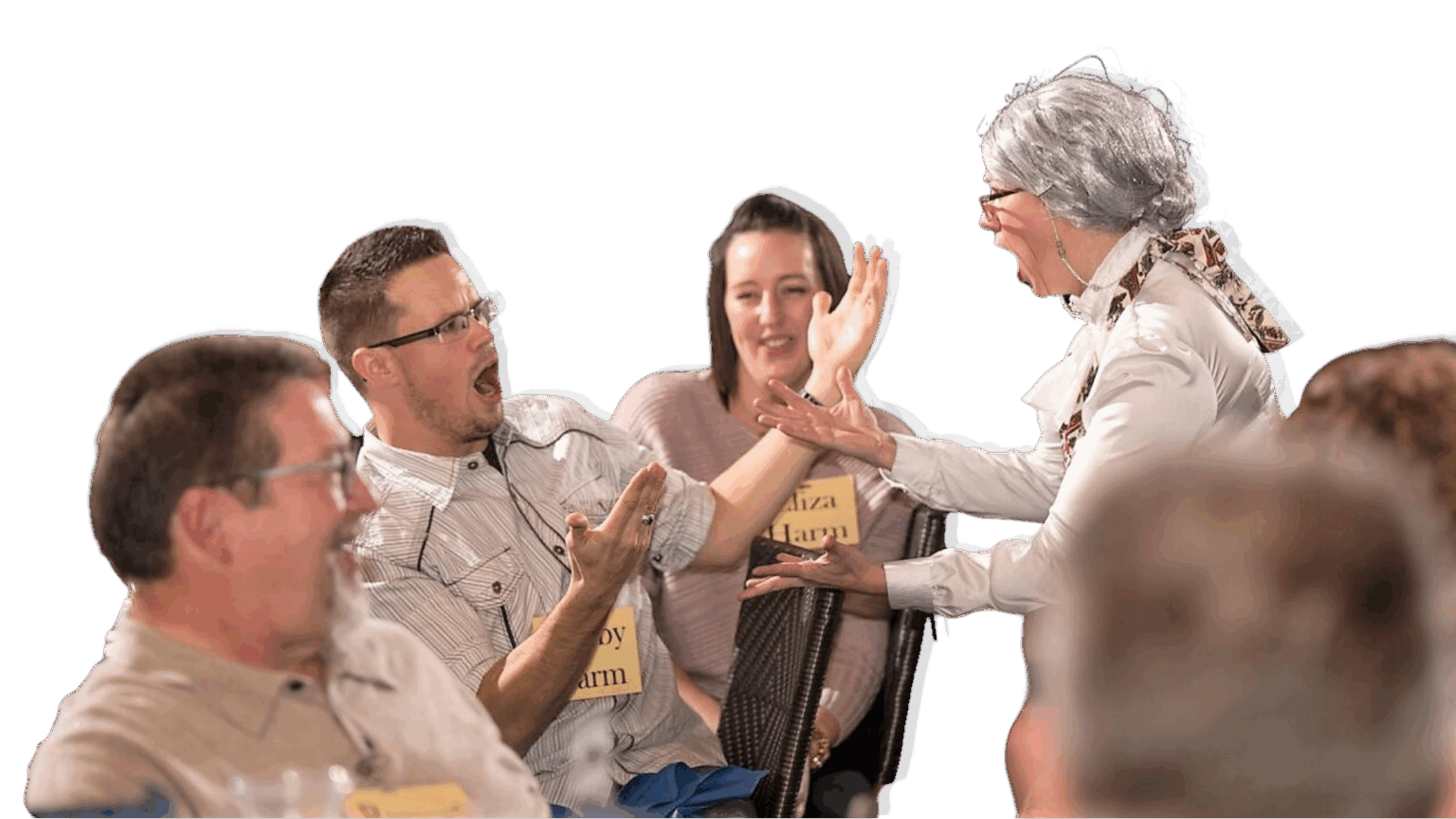 People laughing and interacting at an event