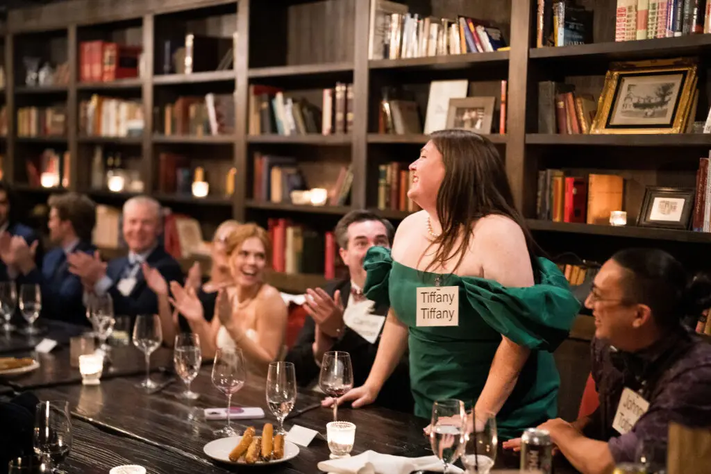 Wedding guests interacting during a murder mystery rehearsal dinner experience